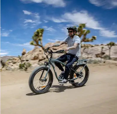 Man riding his Jungle Alpha Murf fat tyre electric bike in on a dirt road in Australia.