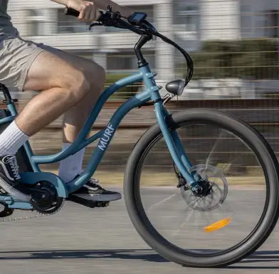 Close up of a moving Murf fat tyre electric bike.