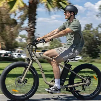 A man riding the Fat Murf fat tyre electric bike on a bike path in Australia.