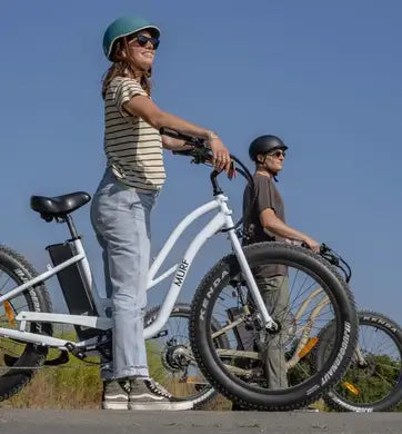 A man and woman out on an adventure on their Murf electric bikes.